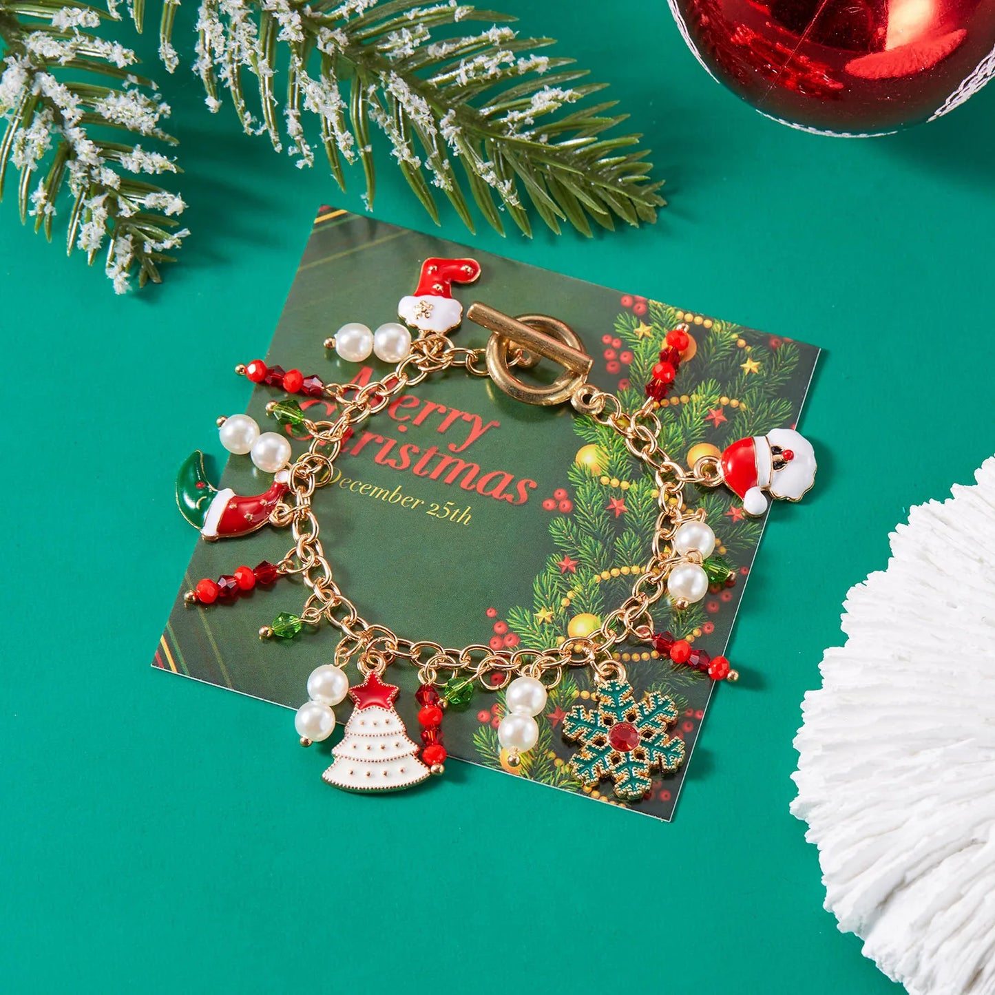 Kerst armband met metalen schakels, kerstman, sneeuwvlok en parels