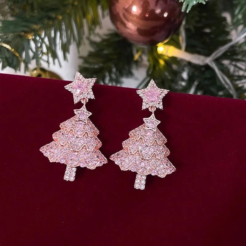 Kerst oorbellen groene strik met bel en rendier hanger – feestelijke damesoorbellen