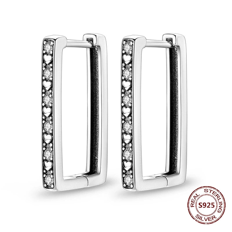 Zilveren oorbellen grote ronde hoops met zirkonia en vloeiend design