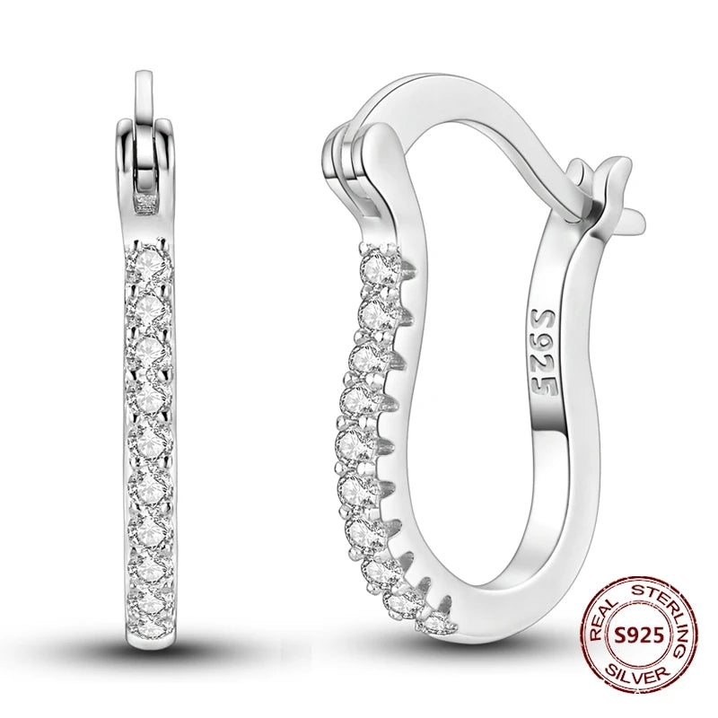 Zilveren oorbellen grote ronde hoops met zirkonia en vloeiend design