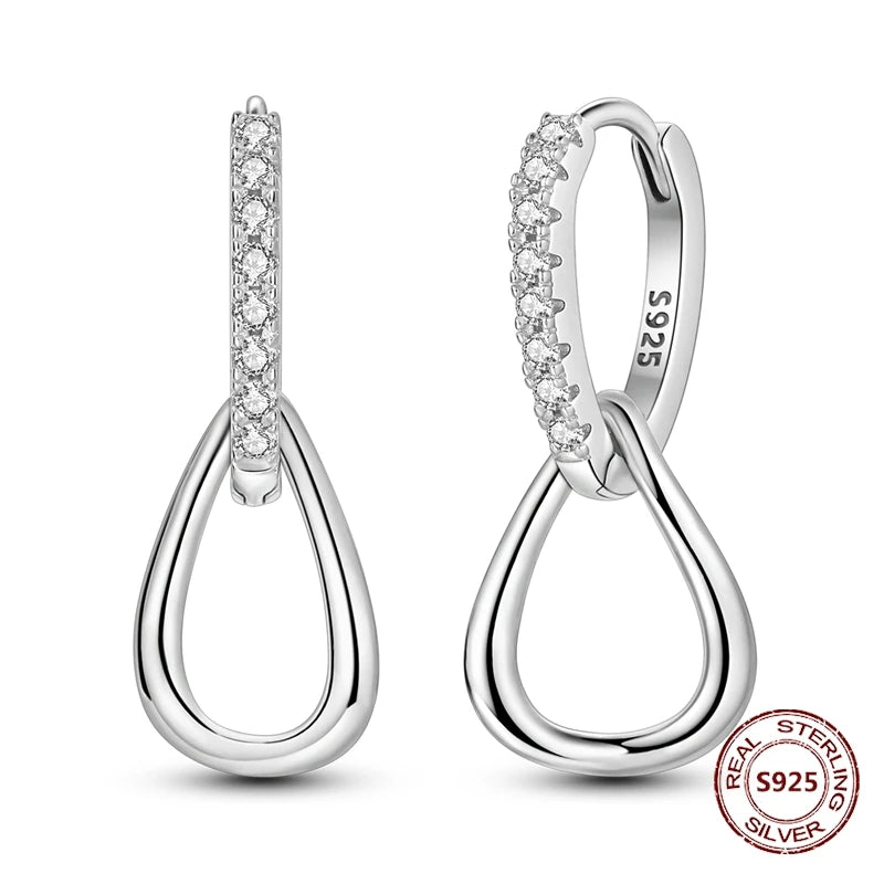 Zilveren oorbellen met lange ketting en geometrisch kruis design