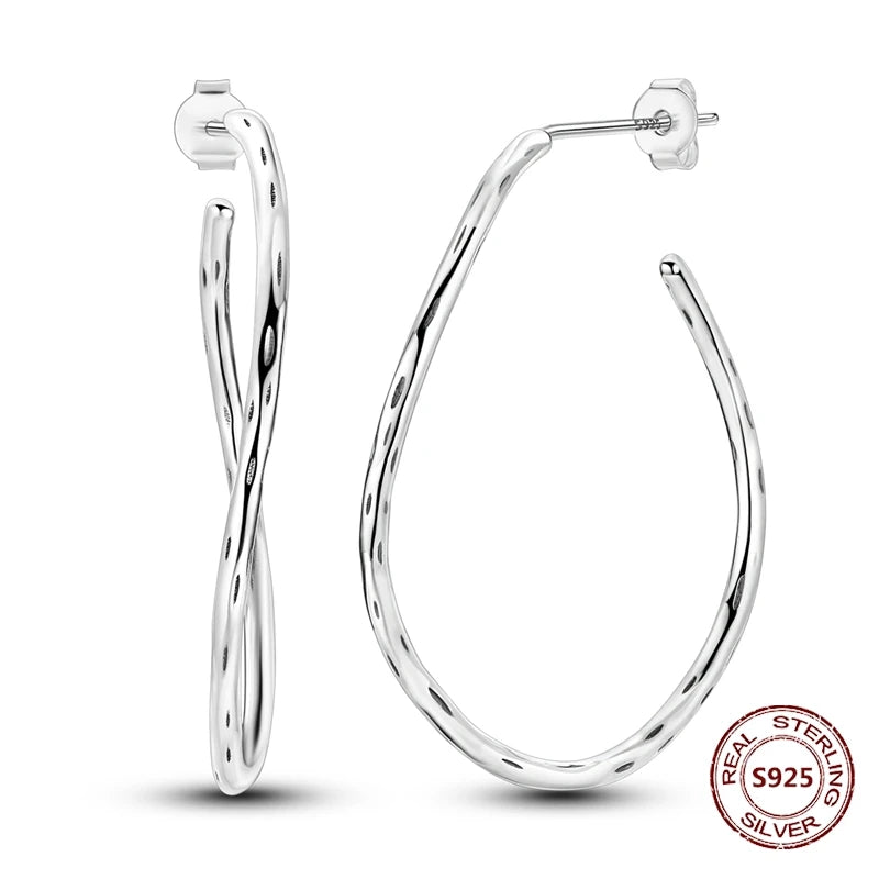 Zilveren oorbellen grote ronde hoops met zirkonia en vloeiend design