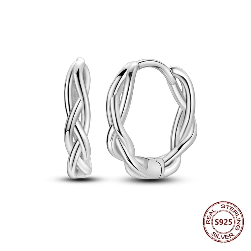 Zilveren oorbellen grote ronde hoops met zirkonia en vloeiend design
