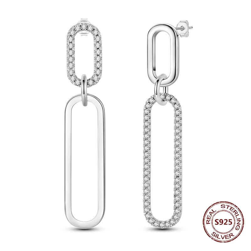 Zilveren oorbellen met lange ketting en geometrisch kruis design