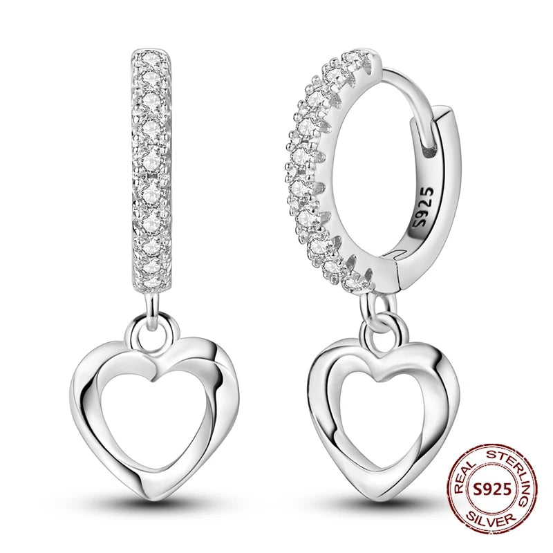 Zilveren oorbellen met lange ketting en geometrisch kruis design