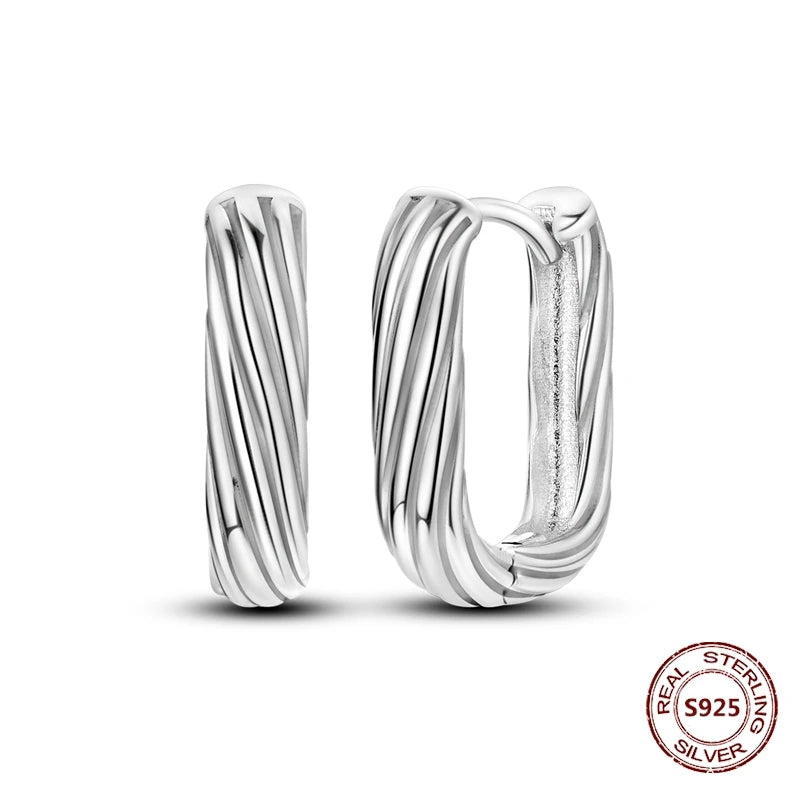 Zilveren oorbellen grote ronde hoops met zirkonia en vloeiend design