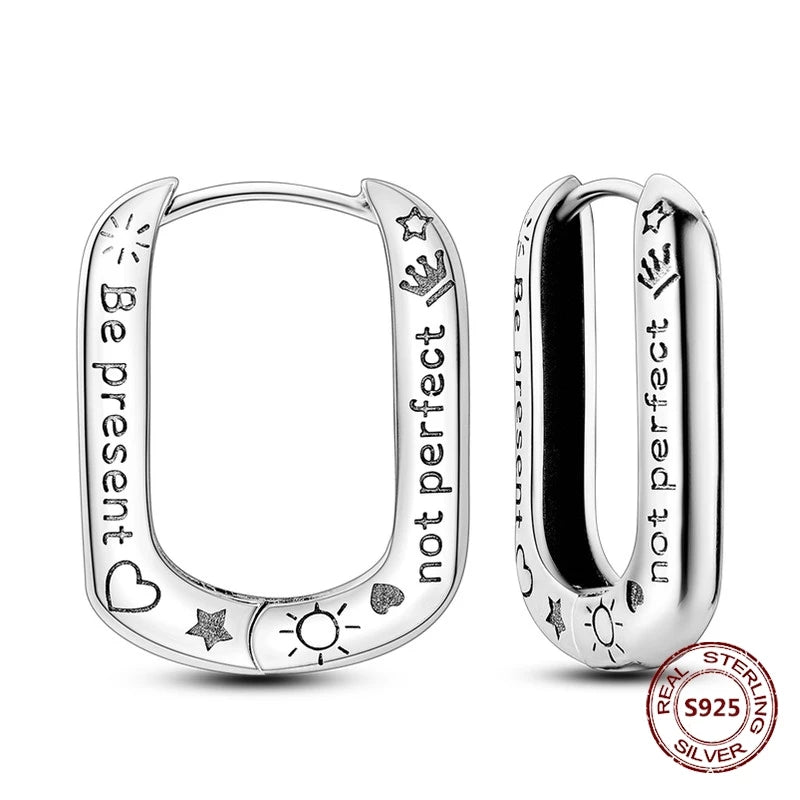 Zilveren oorbellen grote ronde hoops met zirkonia en vloeiend design